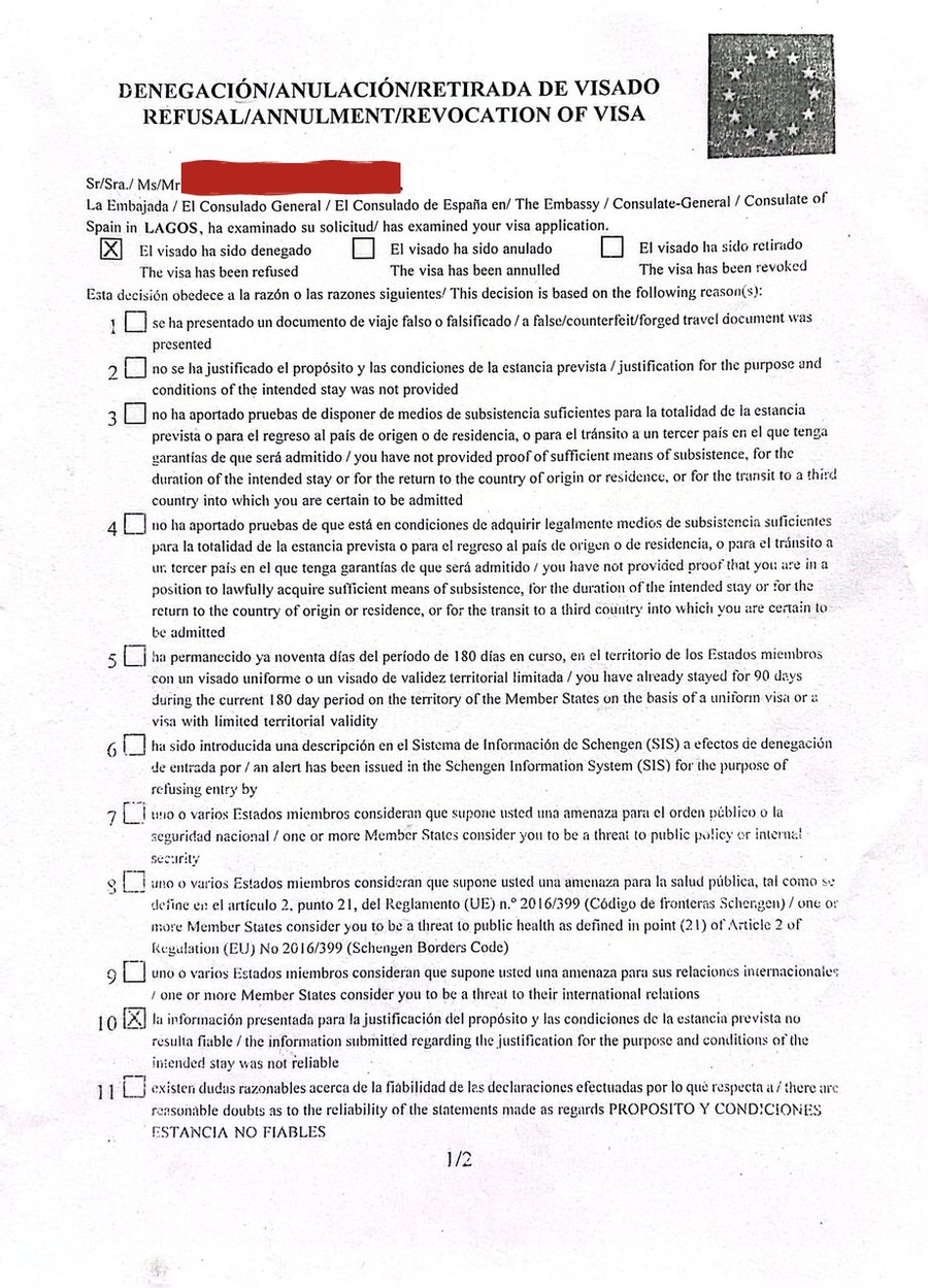 Visa refusal letter from the Consulate of Spain in Lagos, 2023. Box 10 is ticked: the information submitted about the purpose and conditions of the intended stay was not reliable. My name is covered.